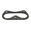 A black gasket that is sitting on the ground.