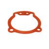 A red rubber gasket that is sitting on the ground.