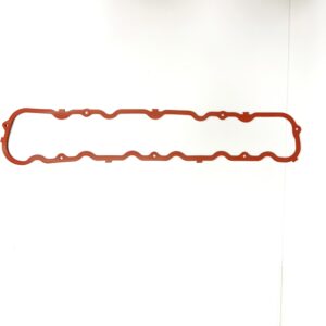 A red rubber gasket is hanging on the wall.