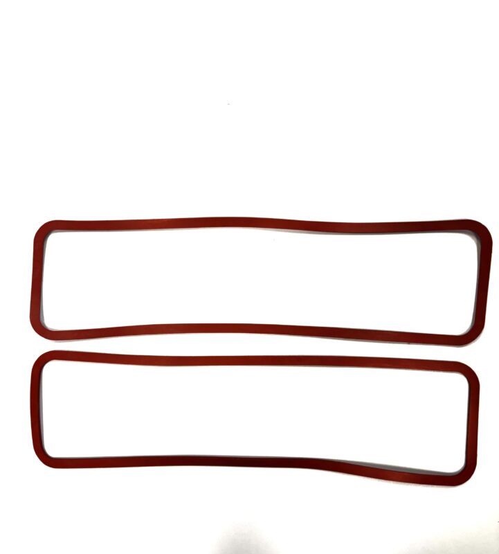 Two red rectangular rubber gaskets.